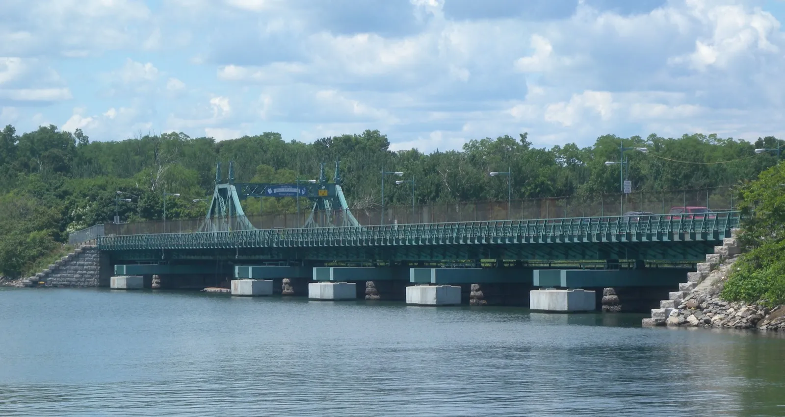 The green steel drawbridge connecting City Island to the mainland Bronx over Eastchester Bay