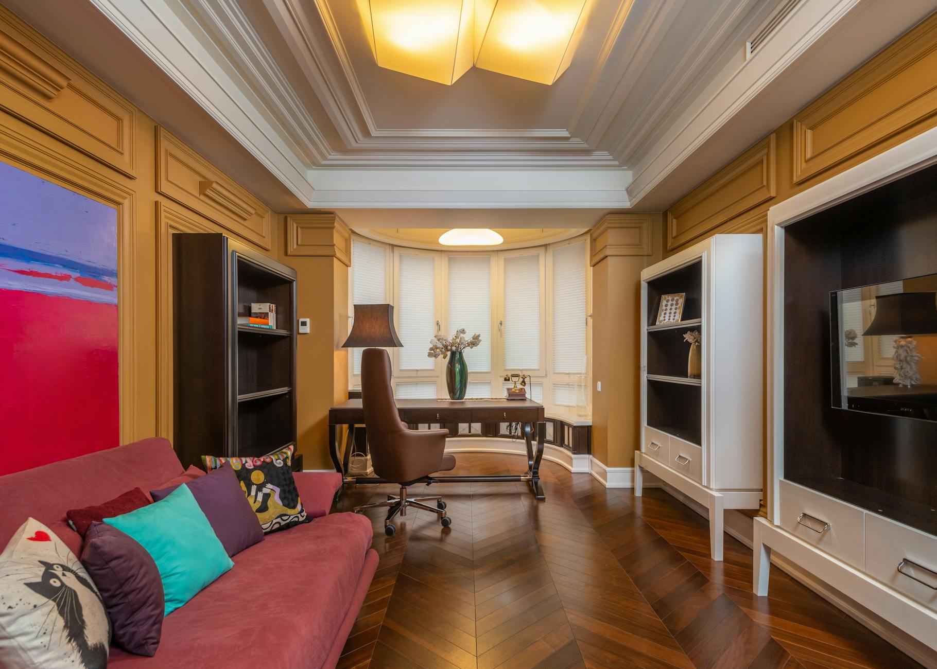classic NYC prewar apartment interior with crown molding, original hardwood floors, cast iron radiator, and tall windows, warm natural light