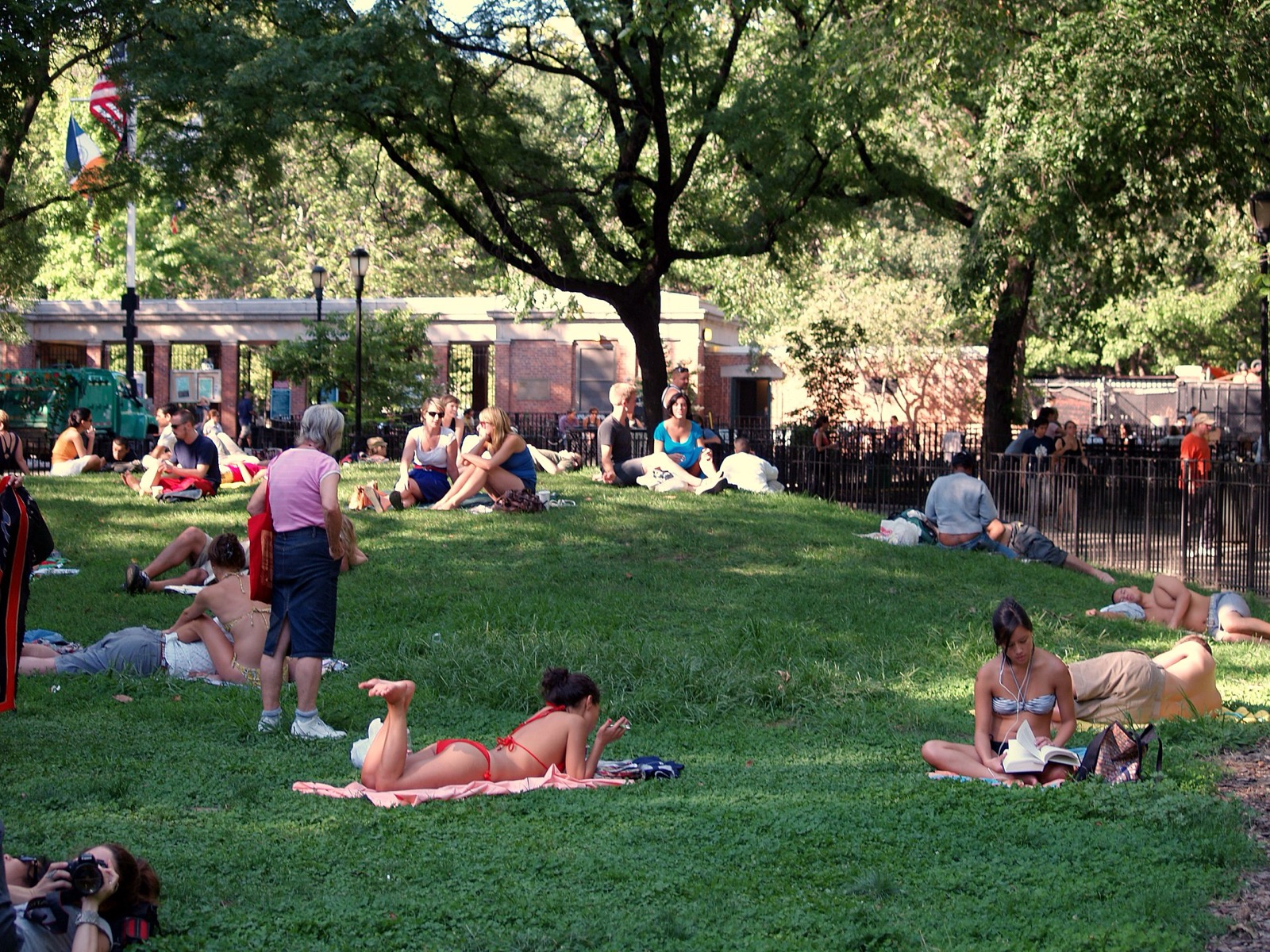 Tompkins Square Park central knoll with mature trees, the green heart of Alphabet City and the East Village where residents gather year-round