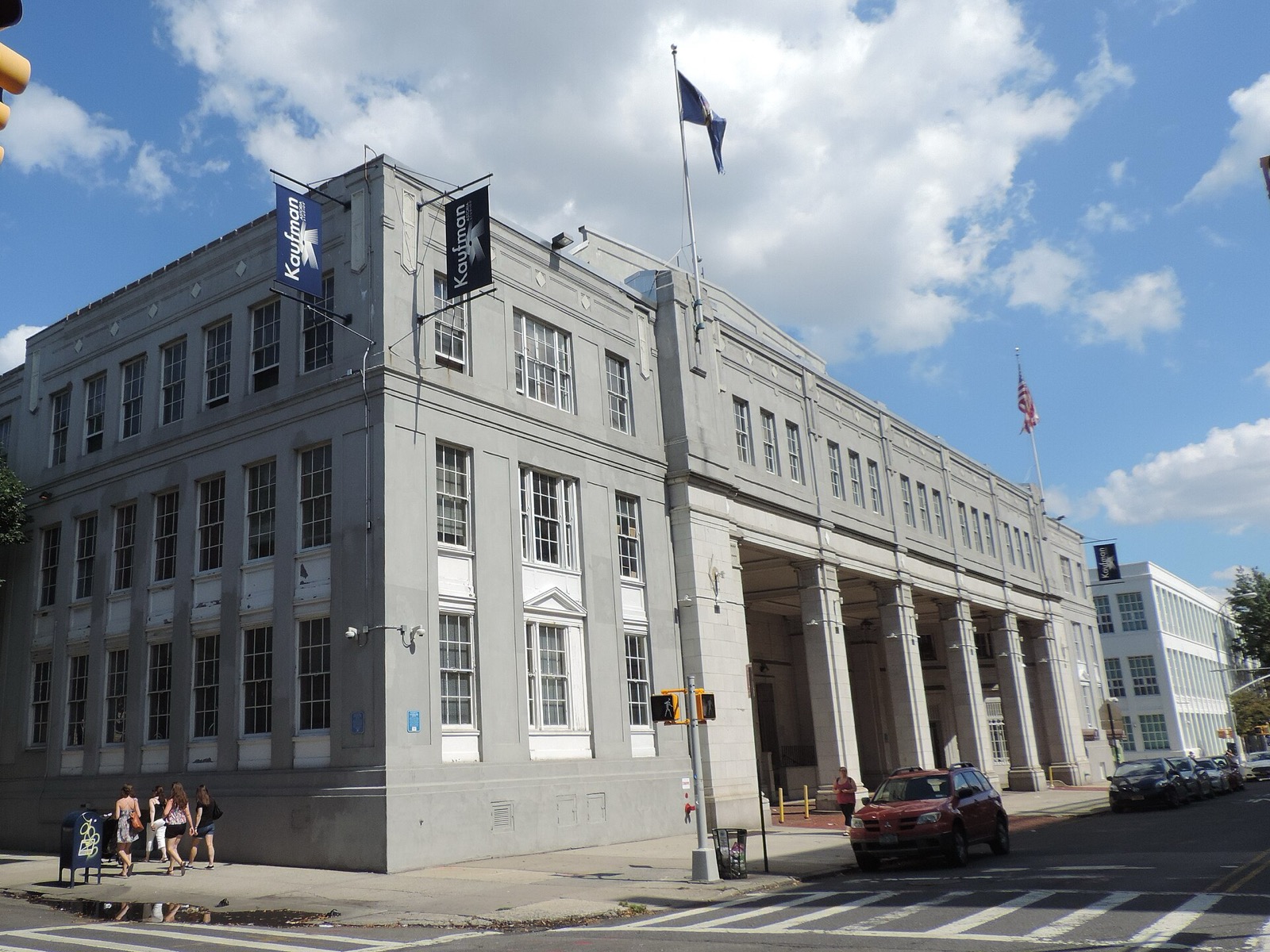Kaufman Astoria Studios building on 35th Avenue showing the Spanish Colonial Revival facade with arched entryways