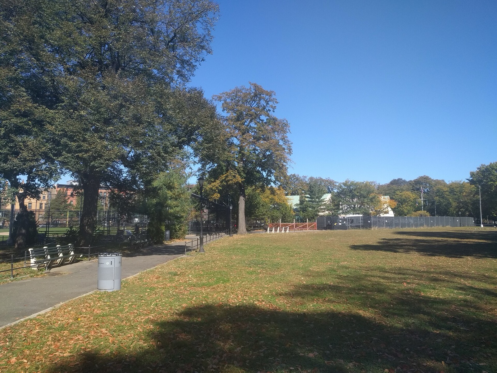 Herbert Von King Park in Bed-Stuy, designed by Frederick Law Olmsted and Calvert Vaux in 1870, with mature trees and the recreation center visible