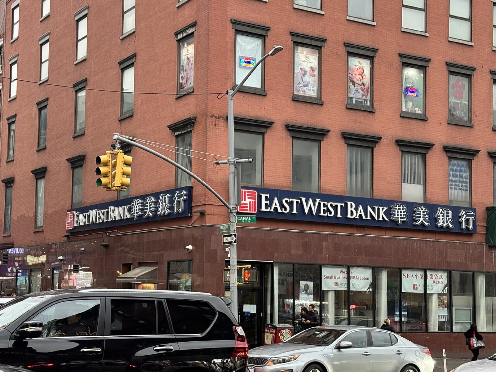 Canal Street in Chinatown with shop awnings, signage, and the constant foot traffic of one of lower Manhattan's busiest commercial corridors