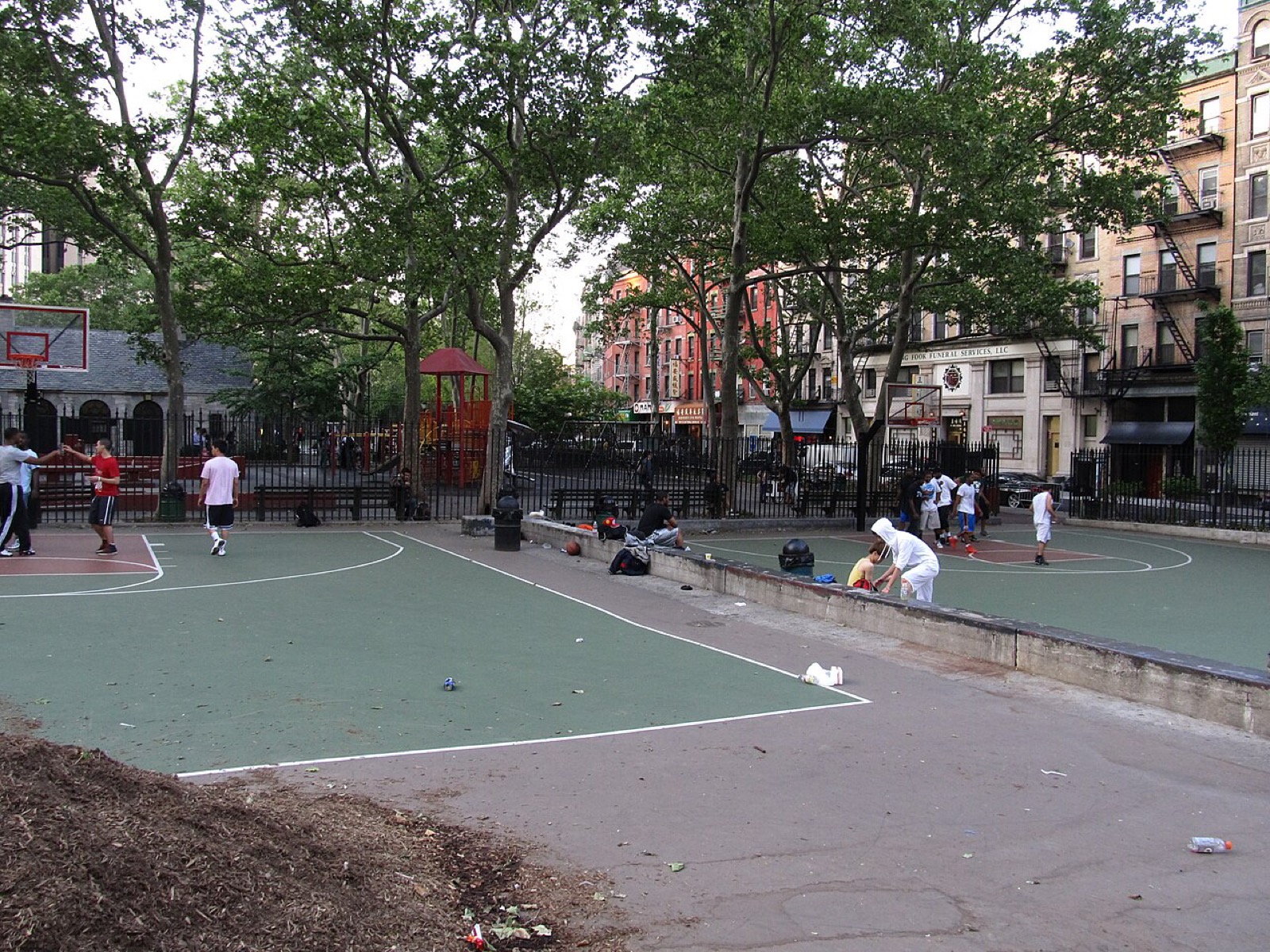 Columbus Park in Chinatown, built on the site of the demolished Five Points slum, with trees, walkways, and community gathering spaces