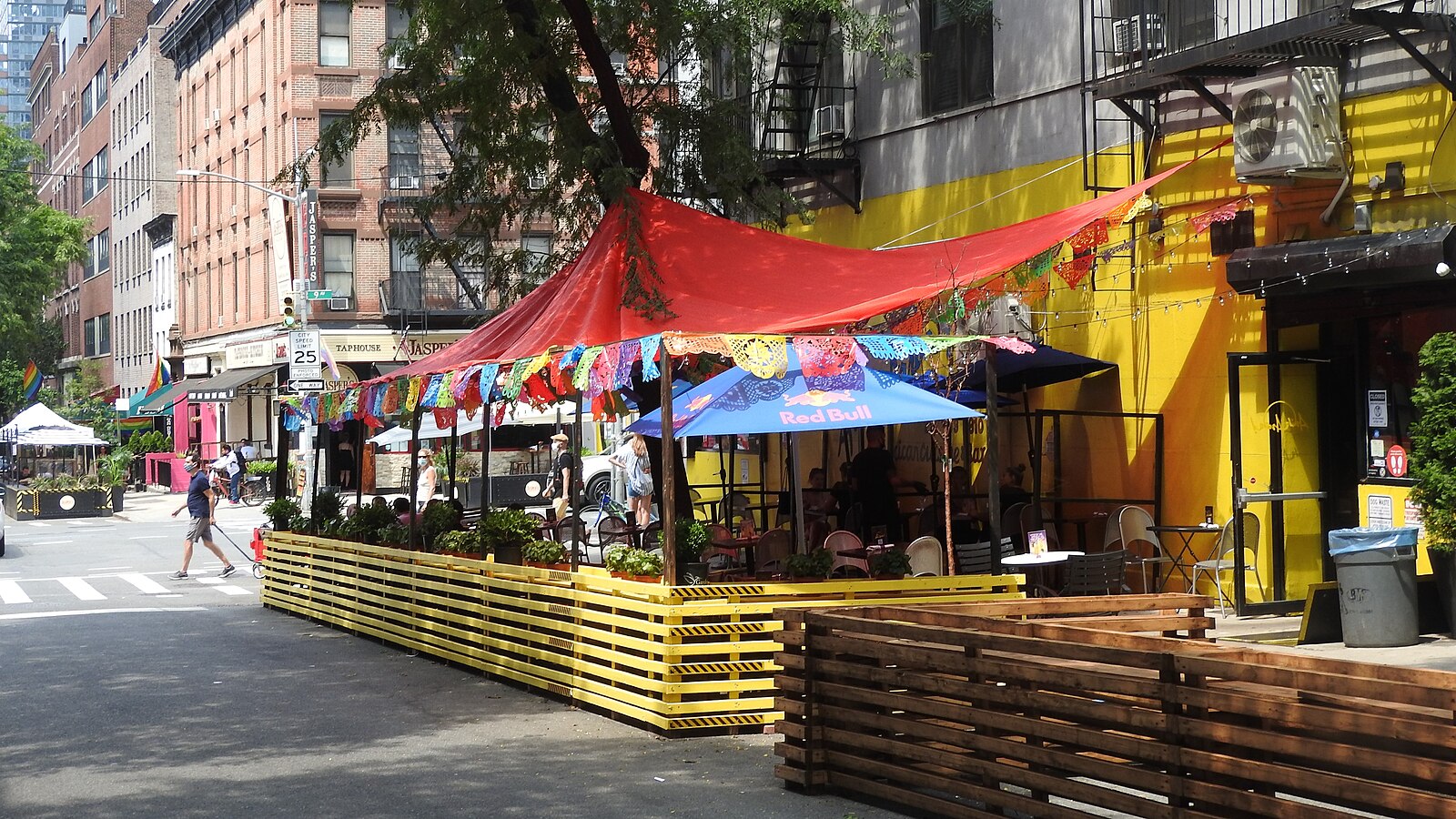 Outdoor dining on West 51st Street in Clinton, Manhattan, showing the neighborhood's residential character away from the commercial avenues