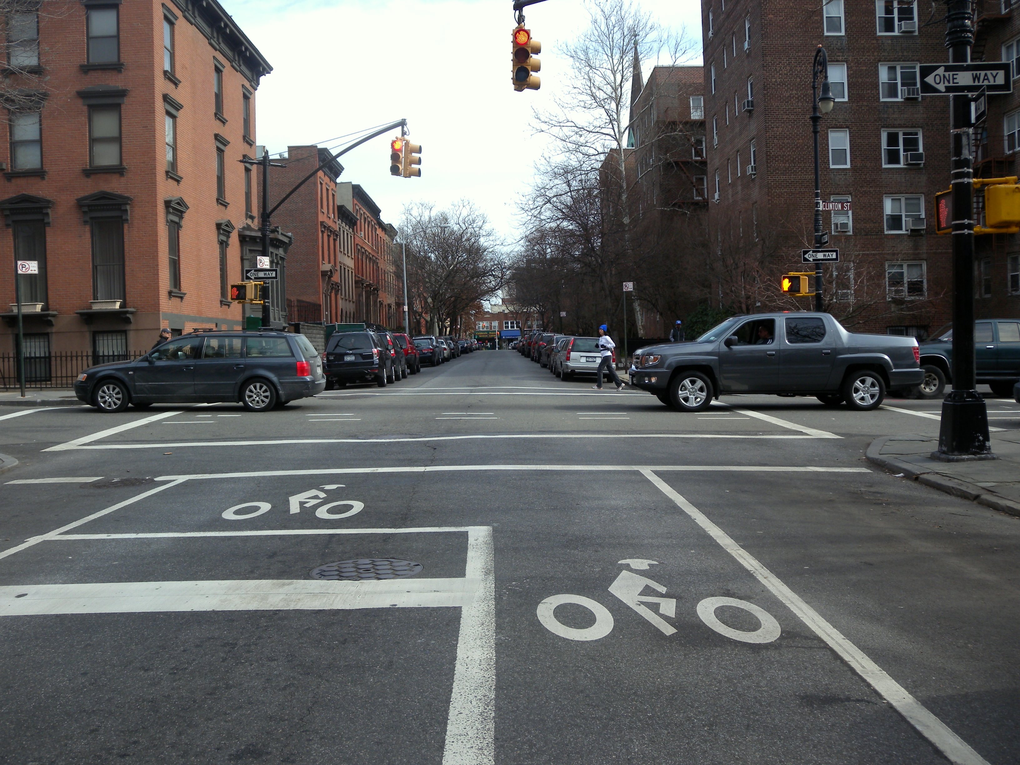 Brownstone facades along Clinton and Congress Streets in Cobble Hill Brooklyn showing stoops, iron railings, and mature street trees on a quiet residential block