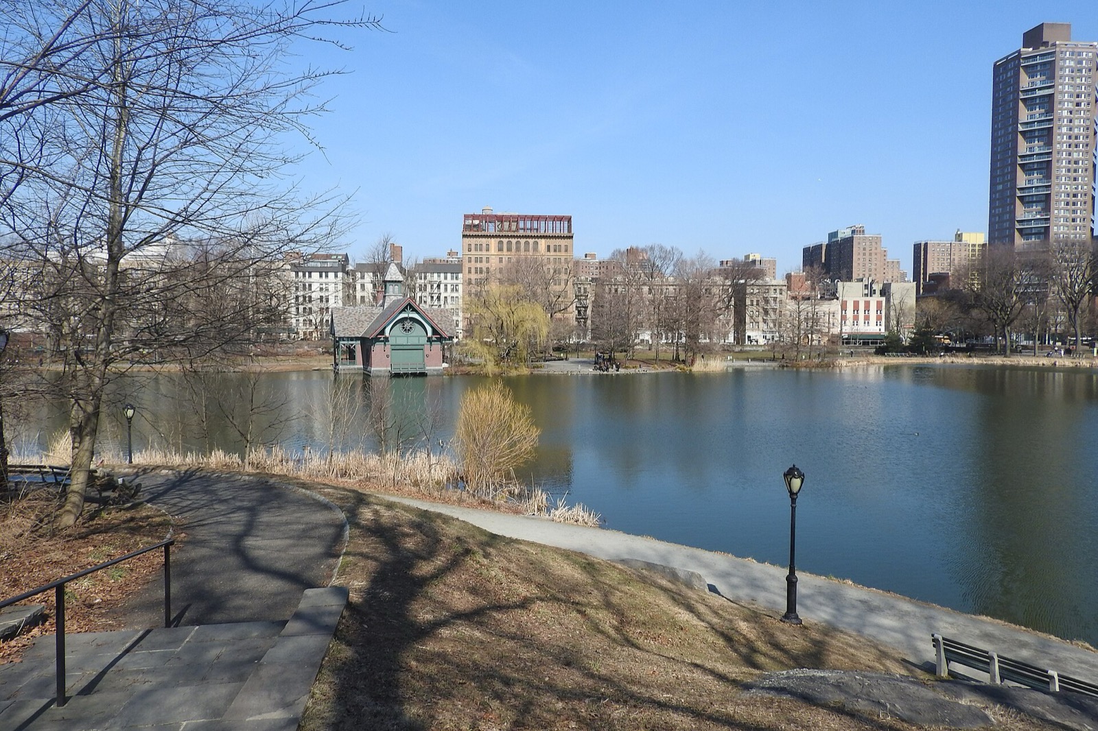 The Harlem Meer at the north end of Central Park bordering East Harlem, an 11-acre lake with the Dana Discovery Center visible on the far shore