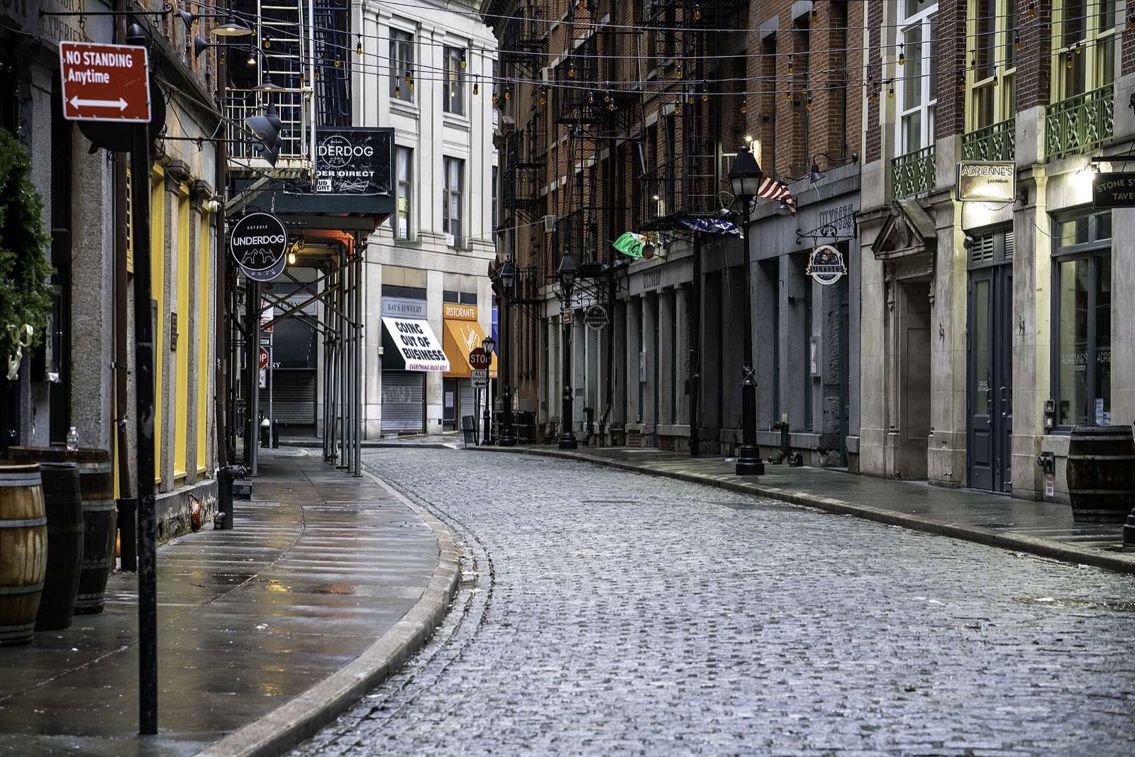 The cobblestone lane of Stone Street in the Financial District, lined with low Federal-style buildings from the 1830s, New York City's oldest paved street