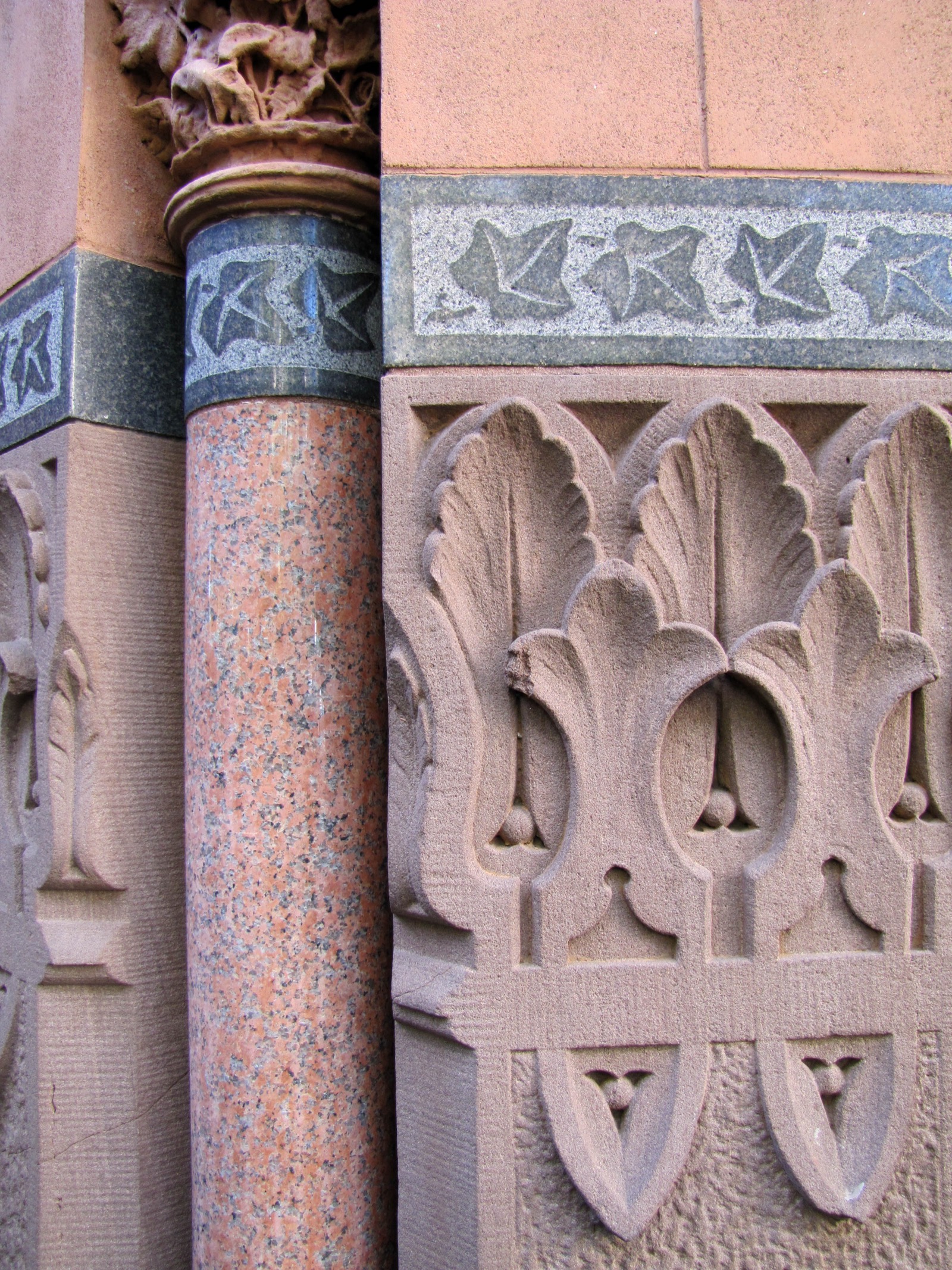 The Victorian Gothic facade of the National Arts Club at 15 Gramercy Park South, showing the elaborate carved stonework, polished granite columns, and ornamental details designed by Calvert Vaux