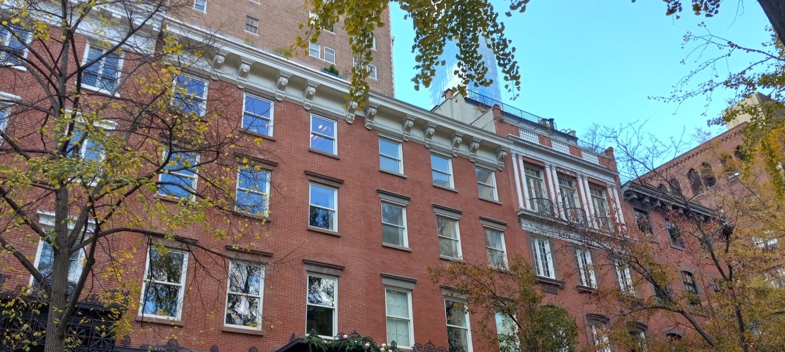 Townhouses and pre-war apartment buildings lining Gramercy Park South, showing the mix of Italianate and Victorian architecture that defines the historic district