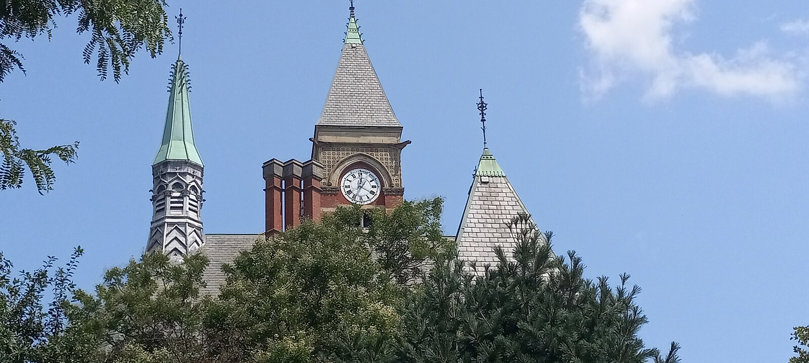 The Jefferson Market Library on Sixth Avenue, a Victorian Gothic former courthouse with a clock tower and rose window, converted to a public library in 1967