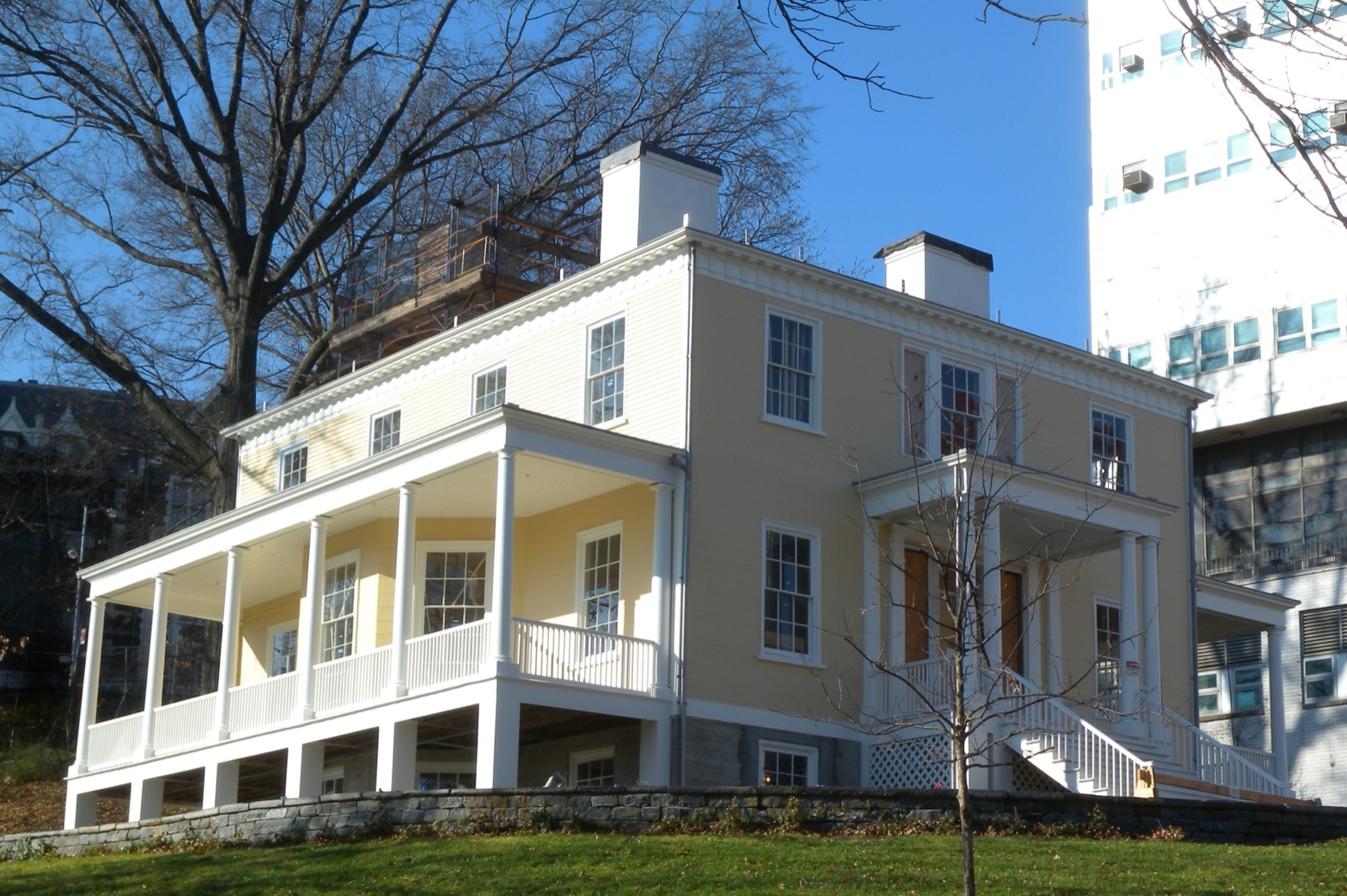 Hamilton Grange National Memorial in St. Nicholas Park showing the Federal-style mansion's columned porch and yellow siding