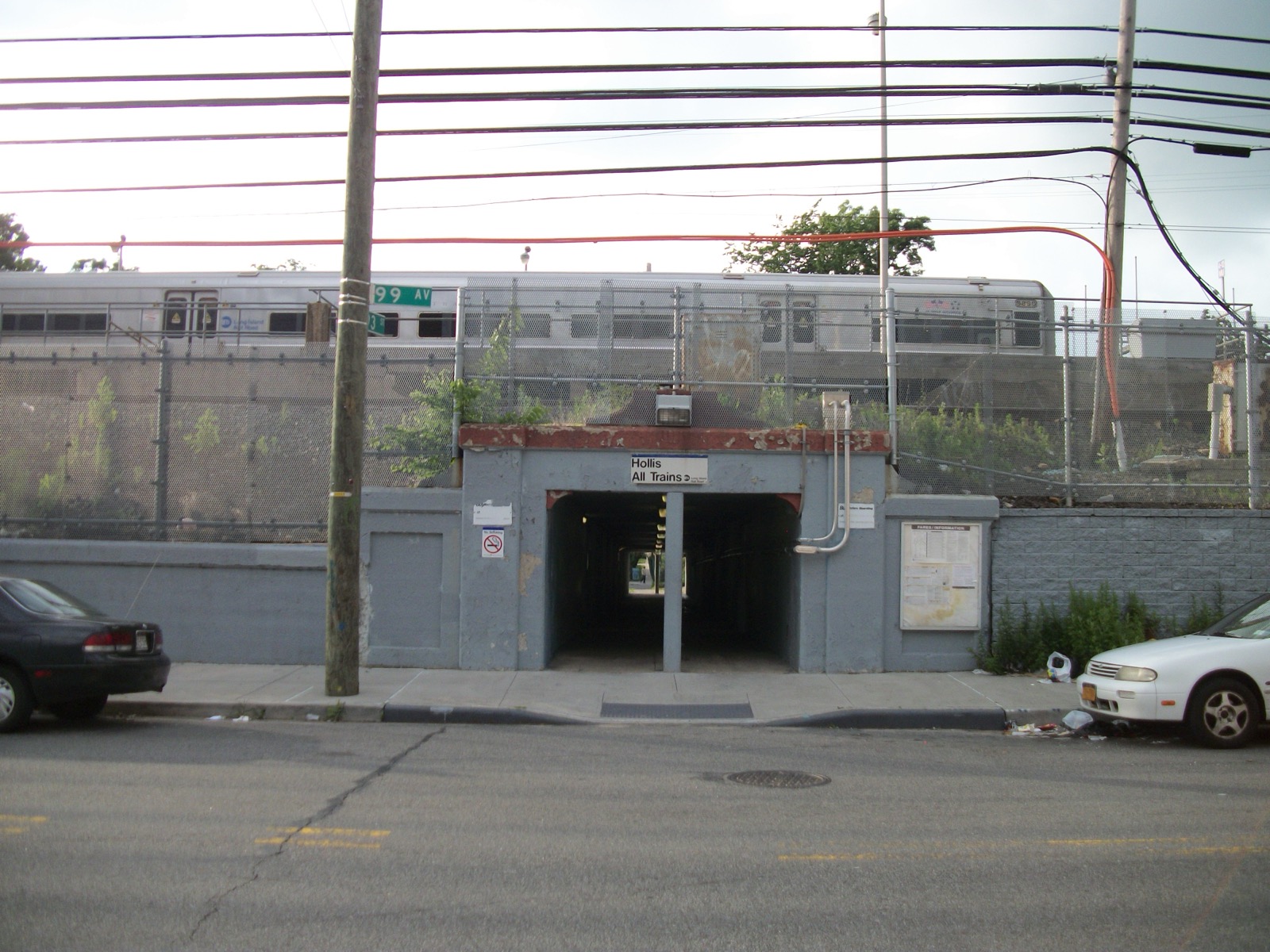 The Hollis LIRR station entrance at 99th Avenue and 193rd Street, the transit landmark that created this neighborhood in 1885 and still connects residents to Jamaica and Penn Station