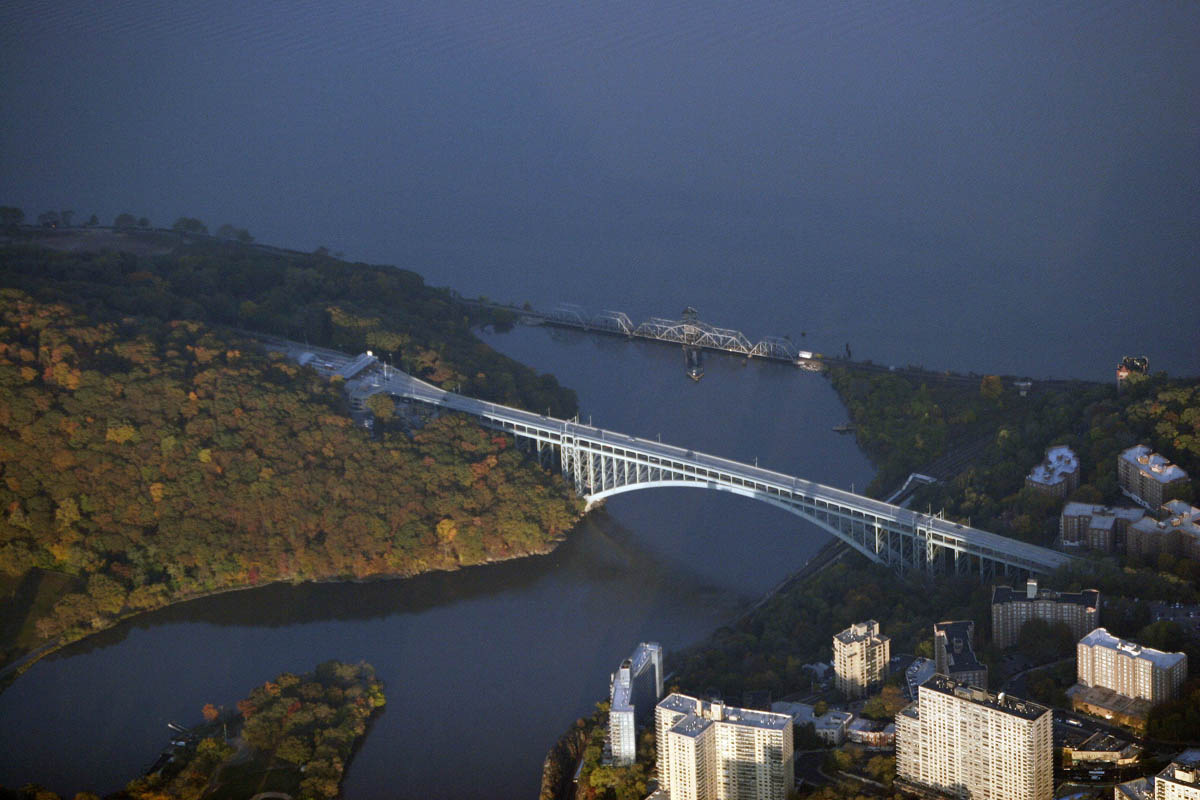The Henry Hudson Bridge spanning the Harlem Ship Canal at the northern tip of Manhattan, connecting Inwood to the Spuyten Duyvil neighborhood of the Bronx