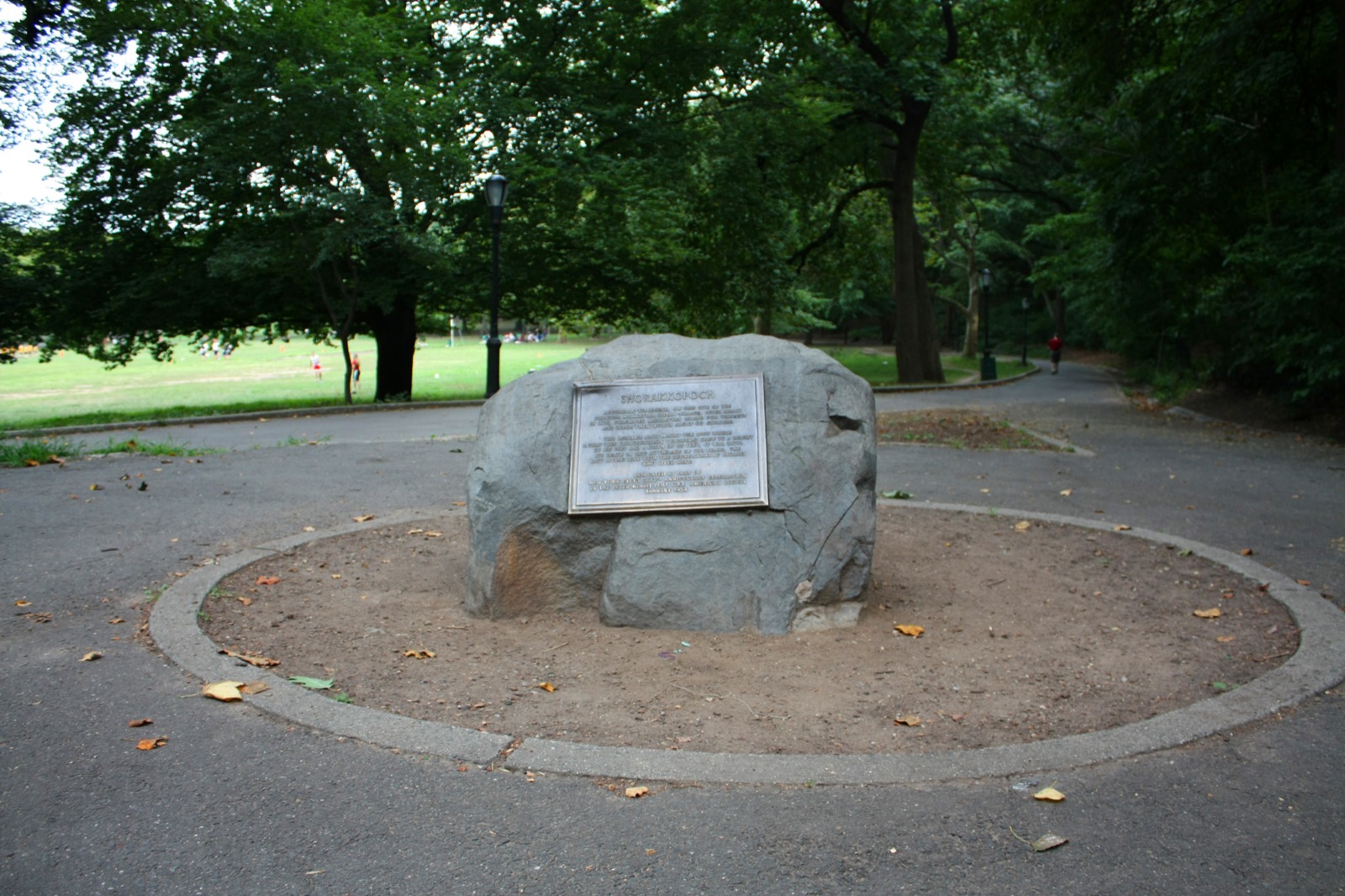 The Shorakkopoch Rock in Inwood Hill Park, a Manhattan schist boulder marking the approximate site where Peter Minuit purchased Manhattan from the Lenape in 1626