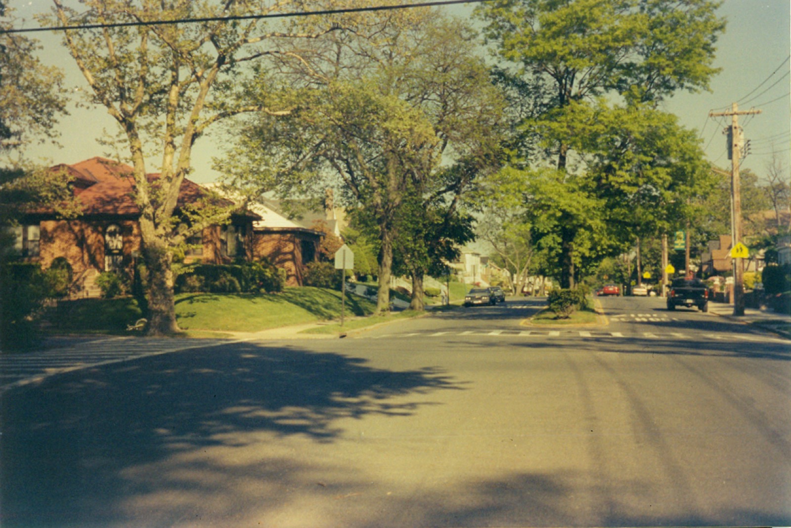 Residential street in Laurelton showing the low-rise single-family homes, front yards, and driveways characteristic of this southeast Queens neighborhood