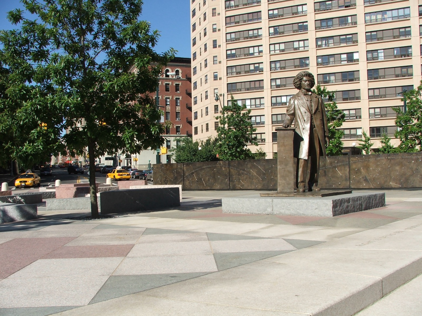 The Frederick Douglass Circle bronze statue at Central Park West and West 110th Street, marking the northern boundary of Manhattan Valley and one of the first public monuments to a Black American on a major New York thoroughfare