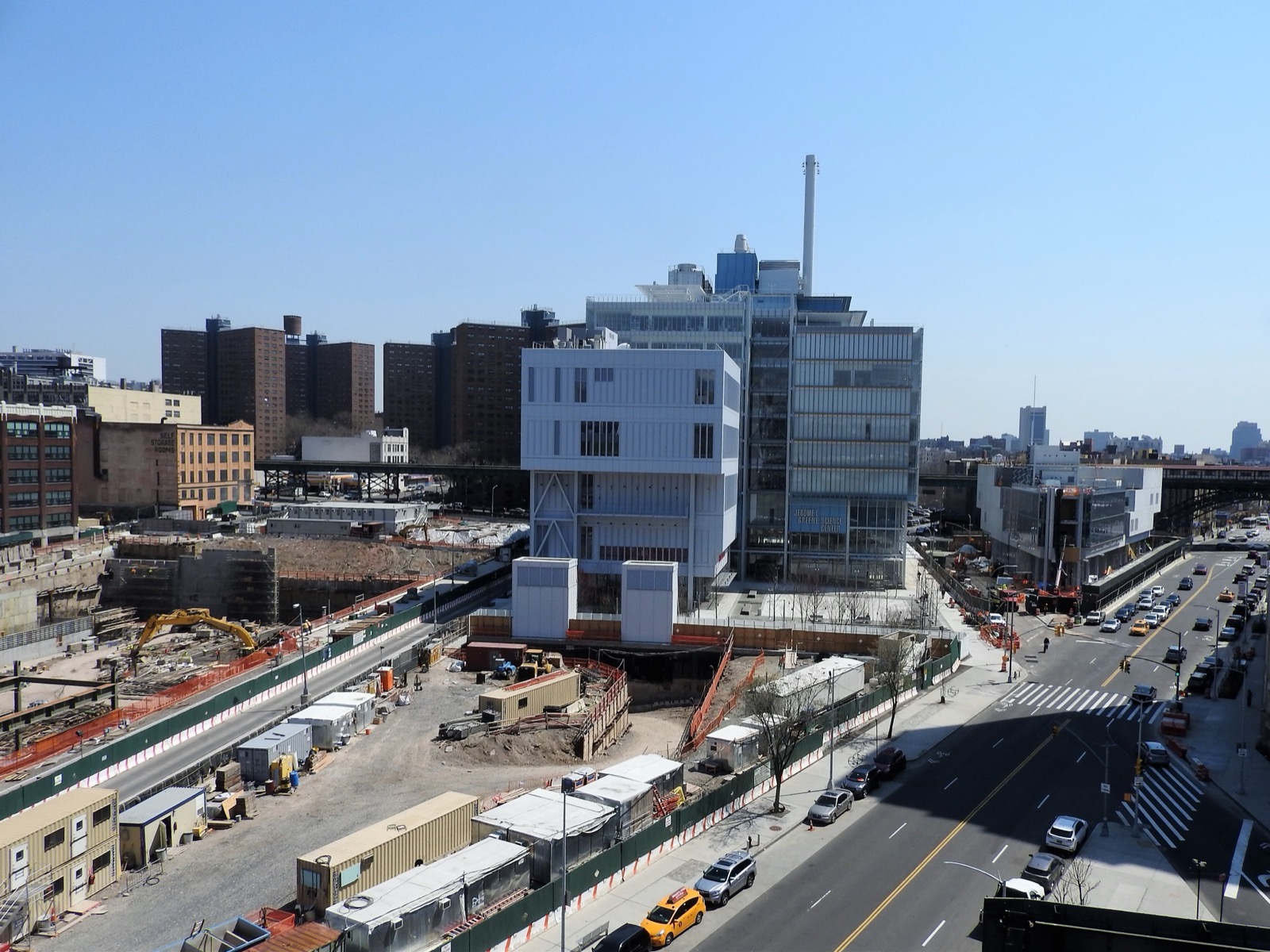 Columbia University's Manhattanville campus along Broadway, showing the transparent glass facades of the Renzo Piano-designed research buildings that opened in 2016