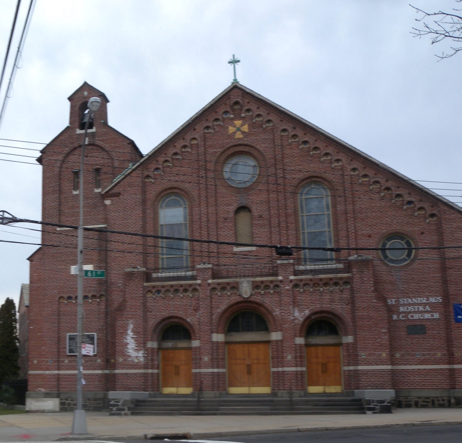 St. Stanislaus Kostka Roman Catholic Church, a red brick parish on 61st Street in Maspeth