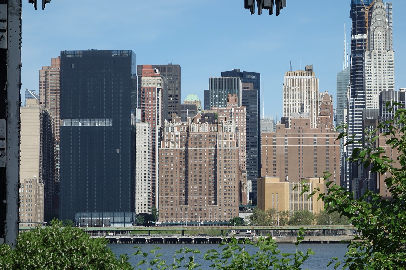 Tudor City residential buildings viewed across the East River, the 1920s apartment complex rising on its bluff above 42nd Street in Midtown Manhattan
