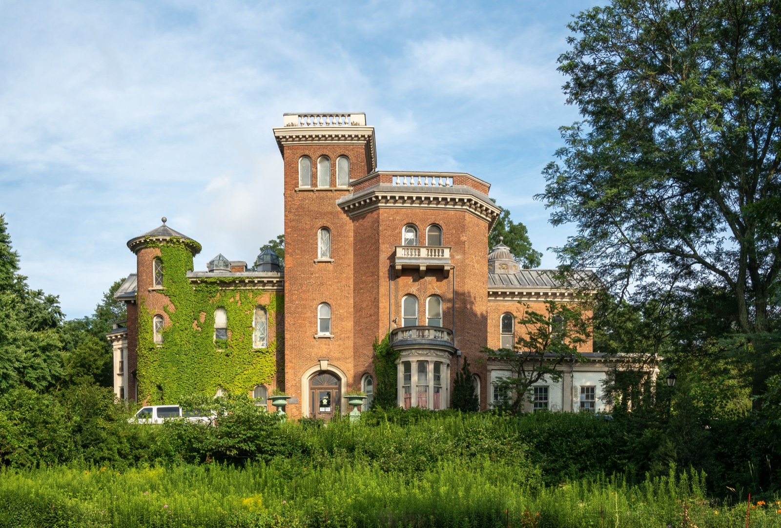 Litchfield Villa in Prospect Park, an Italianate mansion from 1857 with columned porticos and carved stone brackets set among mature trees