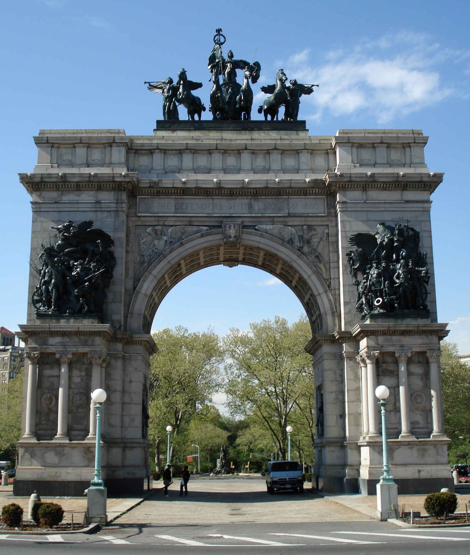 The Soldiers and Sailors Memorial Arch at Grand Army Plaza, an 80-foot triumphal arch with bronze quadriga on top, framed by trees