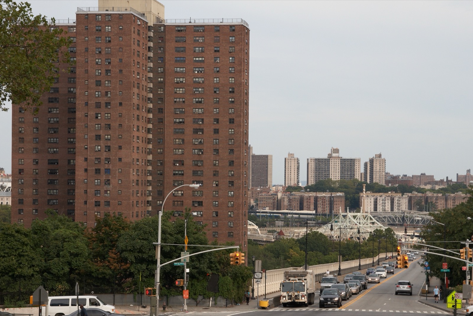 The four 30-story Polo Grounds Towers rising from Coogan's Hollow, with the Harlem River and the Bronx visible beyond