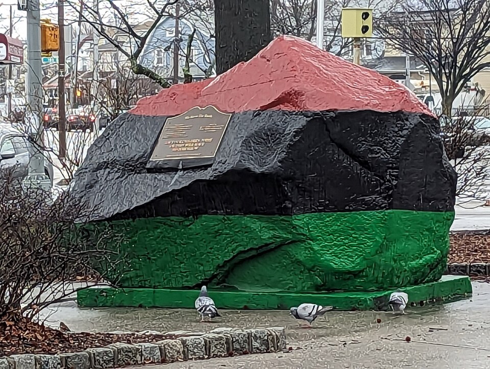 Liberty Rock at the corner of Farmers Boulevard and Liberty Avenue in St. Albans, painted red, black, and green by the Griffin brothers — the city ordered it removed, the neighborhood refused