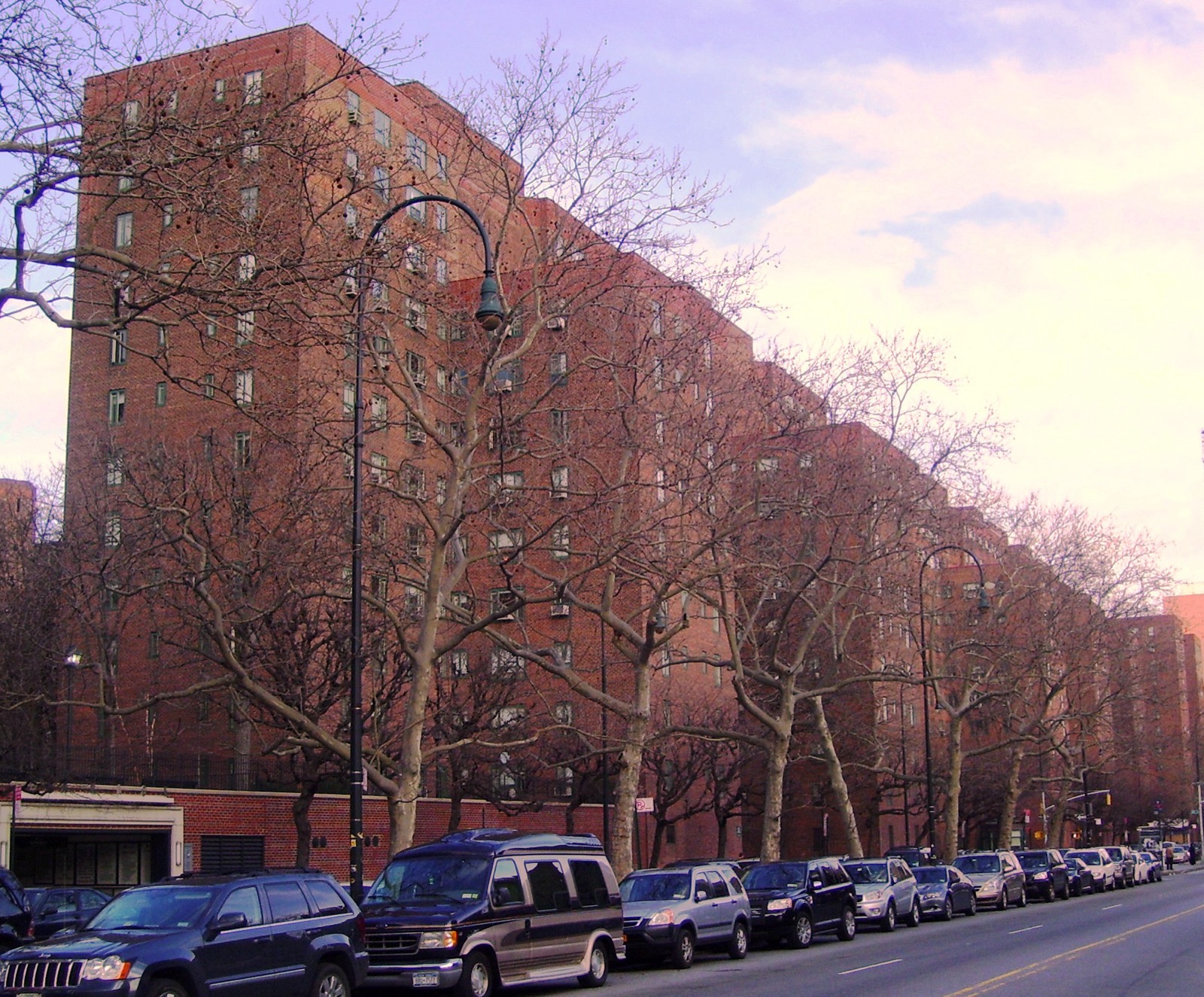 Stuyvesant Town red-brick towers seen from 14th Street looking east, showing the southern boundary of the complex along the major crosstown corridor
