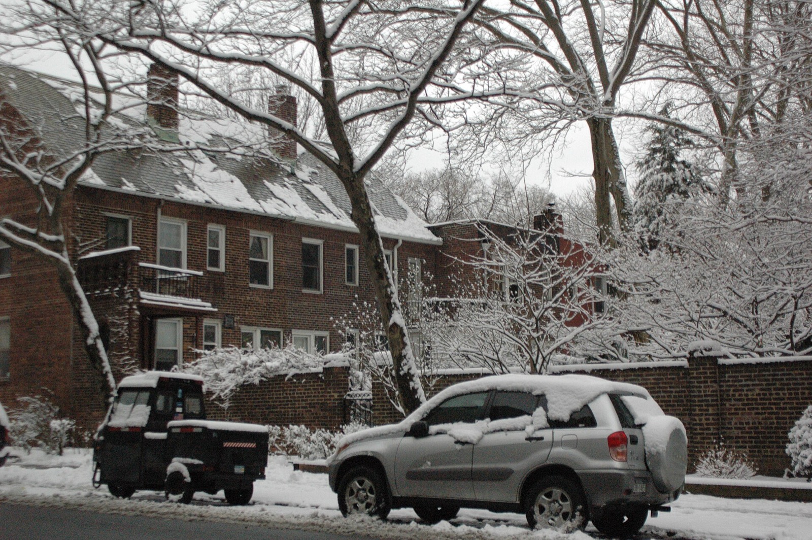 A house on 39th Avenue in the Sunnyside Gardens landmark district, showing the characteristic Hudson brick construction, front garden, and human-scale architecture that influenced a century of urban planning