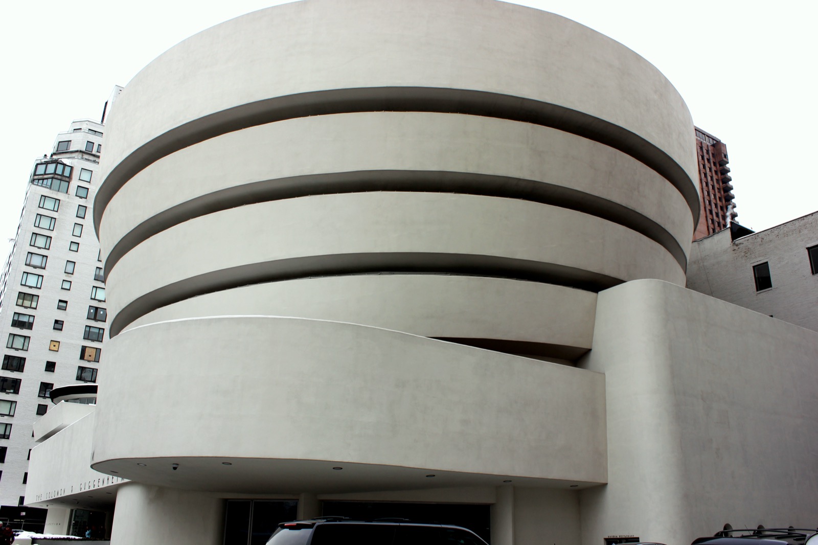 Frank Lloyd Wright's Solomon R. Guggenheim Museum on Fifth Avenue, showing the distinctive spiraling white concrete rotunda