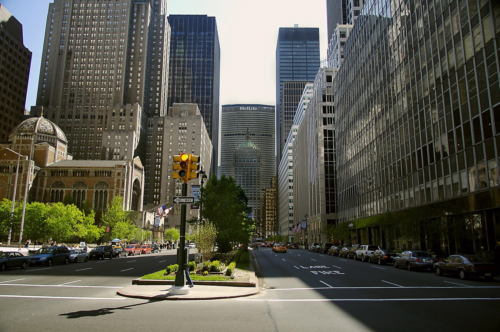 Park Avenue looking north through the Upper East Side, showing the planted median and prewar cooperative apartment buildings flanking both sides of the boulevard