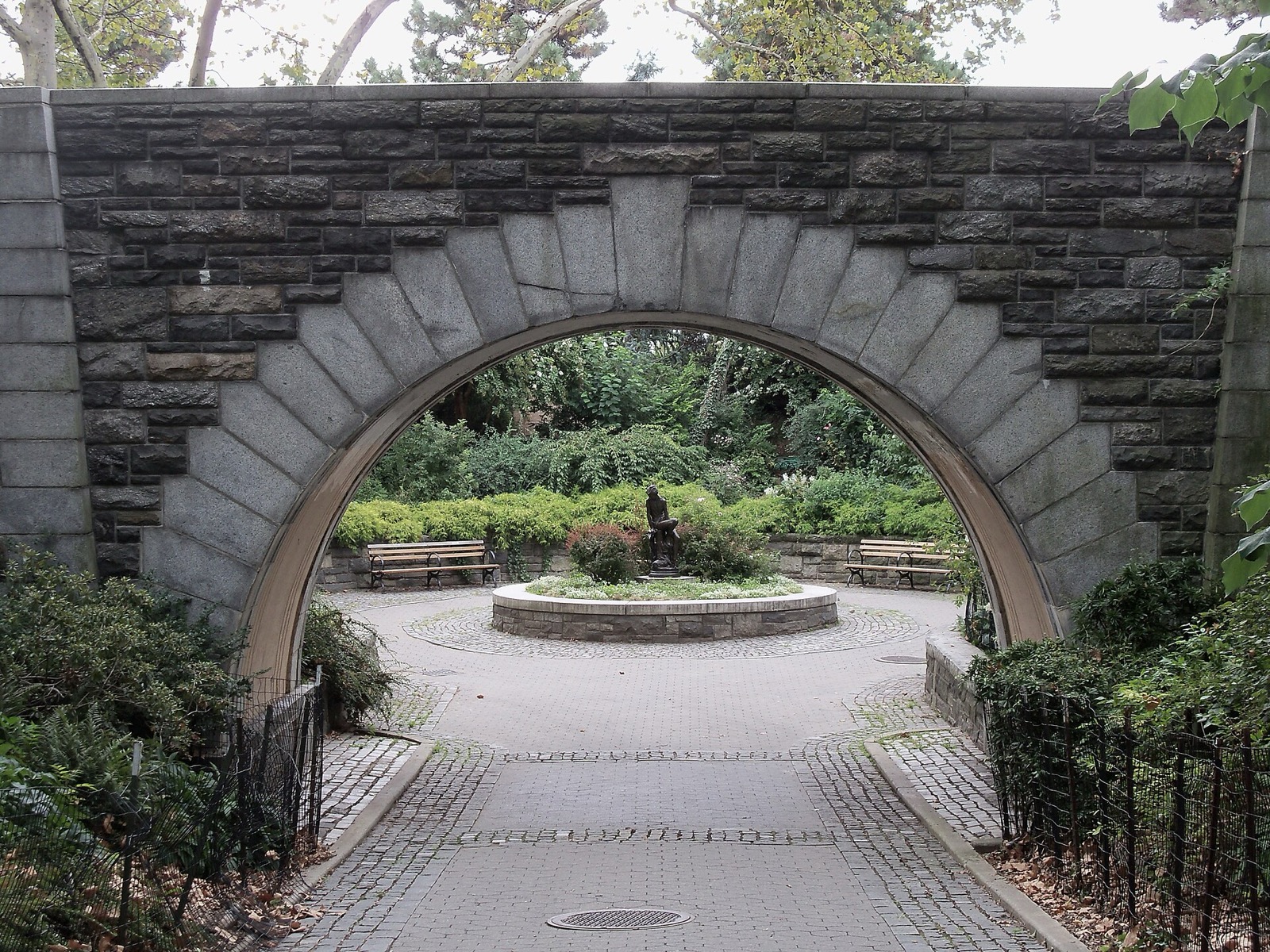 The elevated promenade of Carl Schurz Park along the East River in Yorkville, with views of Queens and the Triborough Bridge